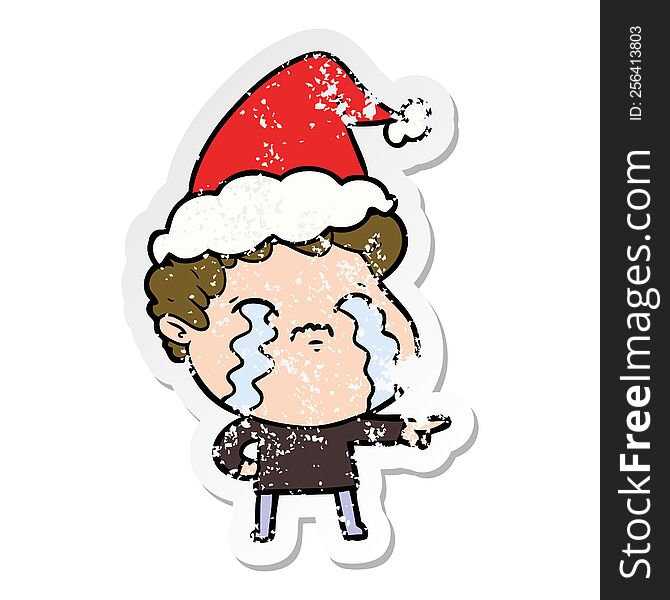 Distressed Sticker Cartoon Of A Man Crying Wearing Santa Hat