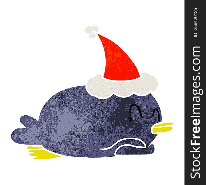 penguin lying on belly wearing santa hat
