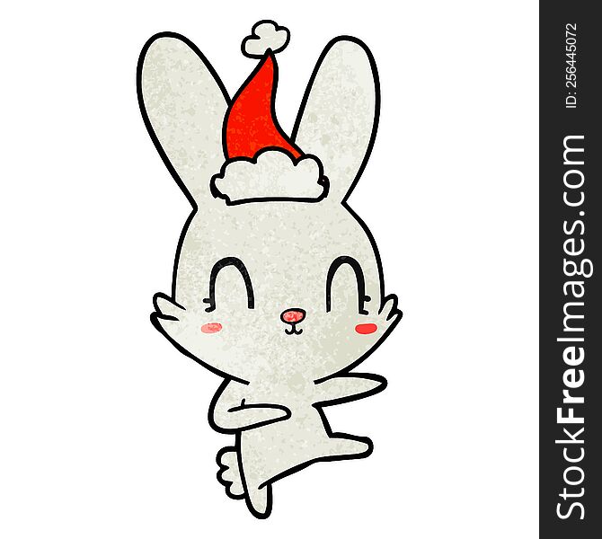 cute hand drawn textured cartoon of a rabbit dancing wearing santa hat. cute hand drawn textured cartoon of a rabbit dancing wearing santa hat