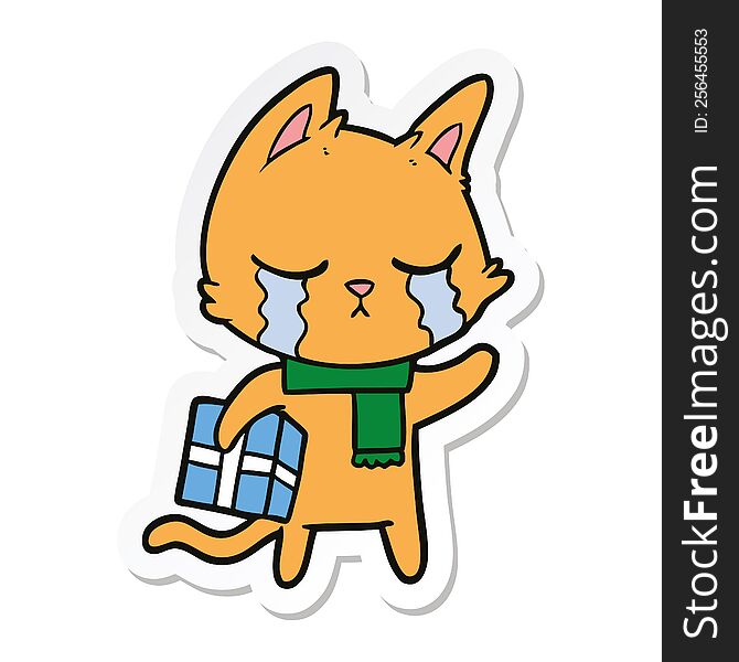 sticker of a crying cartoon cat holding christmas present