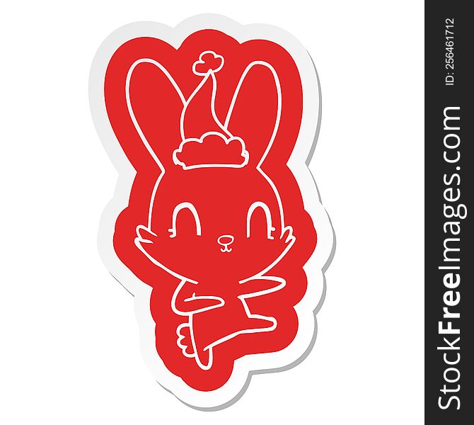 cute quirky cartoon  sticker of a rabbit dancing wearing santa hat