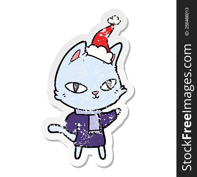 Distressed Sticker Cartoon Of A Cat Staring Wearing Santa Hat