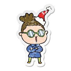 Distressed Sticker Cartoon Of A Woman Wearing Spectacles Wearing Santa Hat Stock Photo