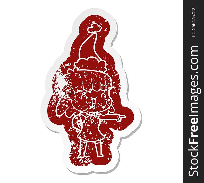 quirky cartoon distressed sticker of a happy girl wearing santa hat