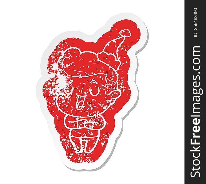 happy quirky cartoon distressed sticker of a man wearing santa hat