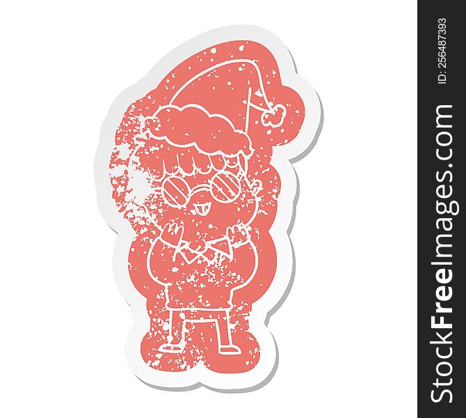 quirky cartoon distressed sticker of a boy wearing spectacles wearing santa hat