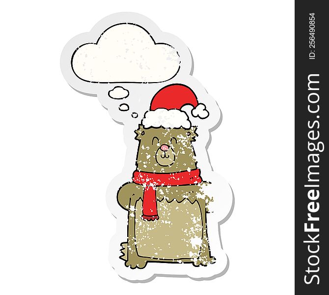 Cartoon Bear Wearing Christmas Hat And Thought Bubble As A Distressed Worn Sticker