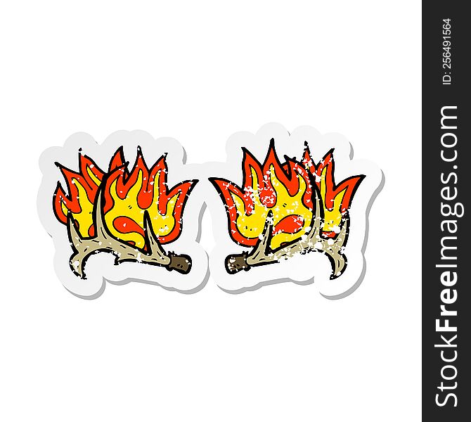 Retro Distressed Sticker Of A Cartoon Flaming Antlers