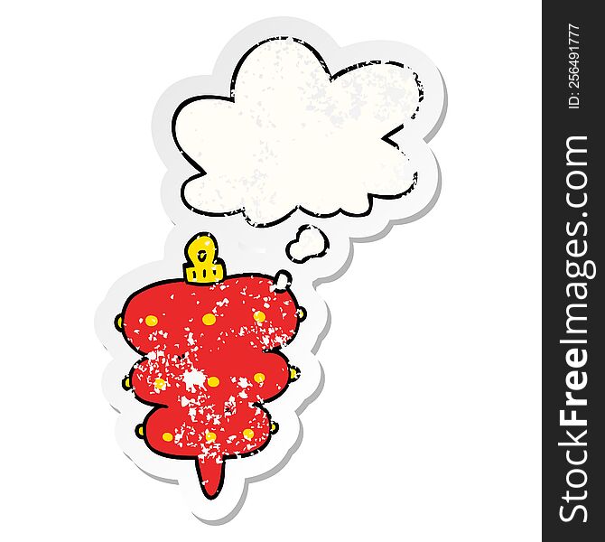 cartoon christmas decoration with thought bubble as a distressed worn sticker
