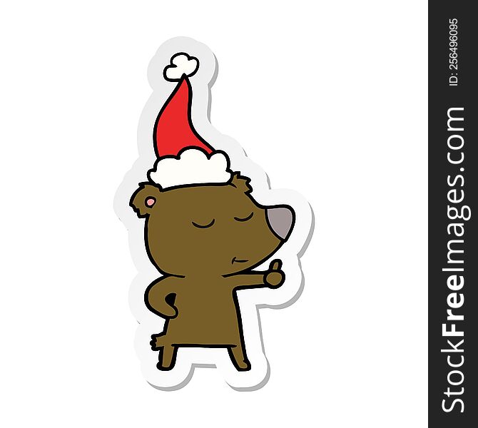 happy hand drawn sticker cartoon of a bear giving thumbs up wearing santa hat