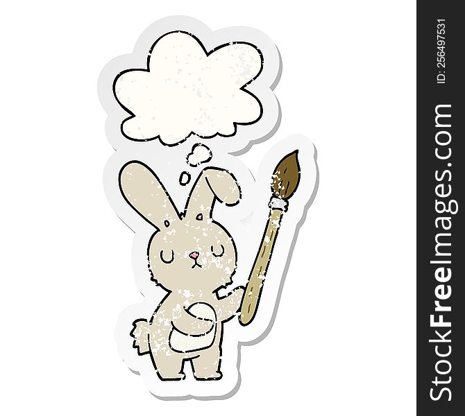 cartoon rabbit with paint brush with thought bubble as a distressed worn sticker