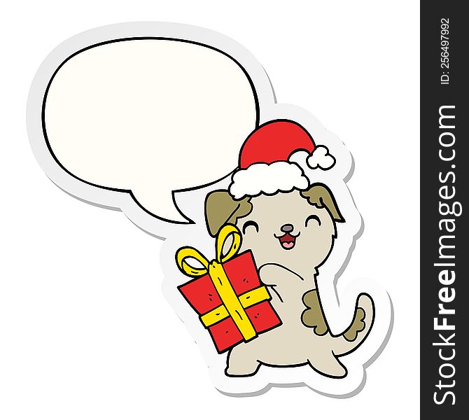 cute cartoon puppy with christmas present and hat with speech bubble sticker. cute cartoon puppy with christmas present and hat with speech bubble sticker