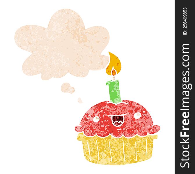 cartoon cupcake with candle and thought bubble in retro textured style