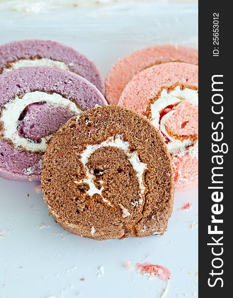 Swiss roll -strawberry , taro and chocolate