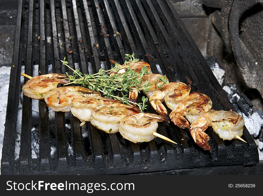 Cooking shrimp on the grill in the restaurant. Cooking shrimp on the grill in the restaurant