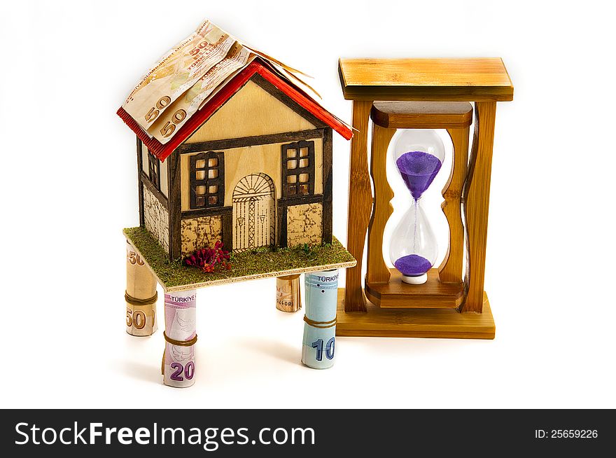 Hourglass, home, money  on white background