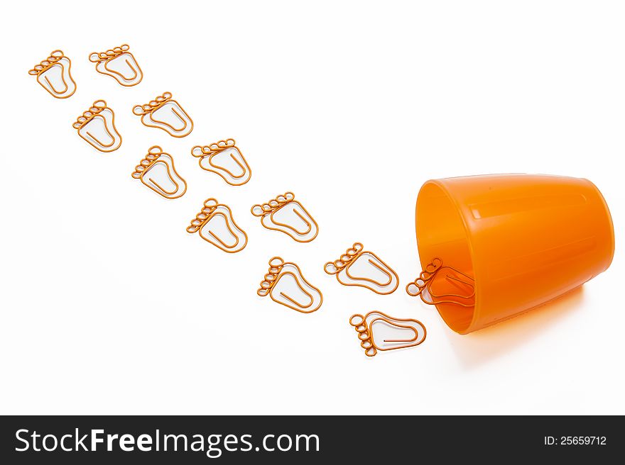 Orange foot shape paper clip isolated on white background