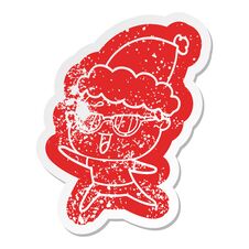 Cartoon Distressed Sticker Of A Happy Woman Wearing Spectacles Wearing Santa Hat Stock Photography