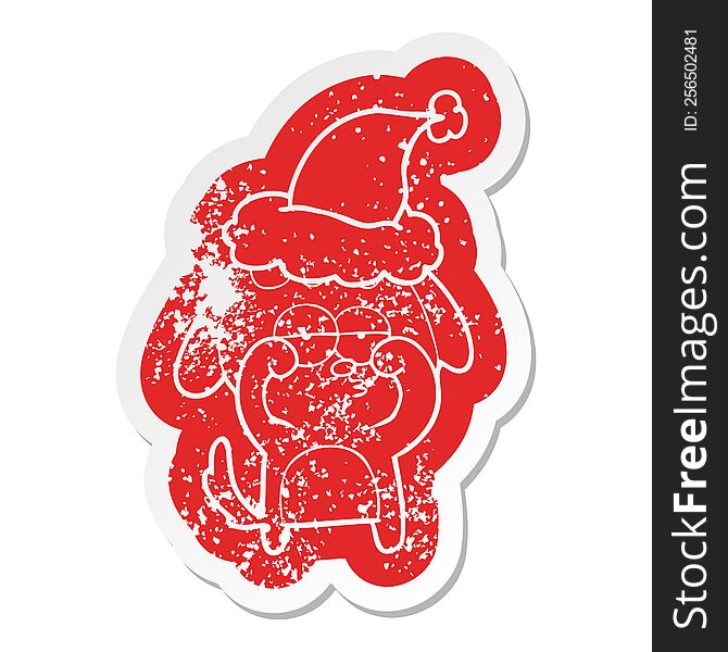 Cartoon Distressed Sticker Of A Tired Dog Wearing Santa Hat