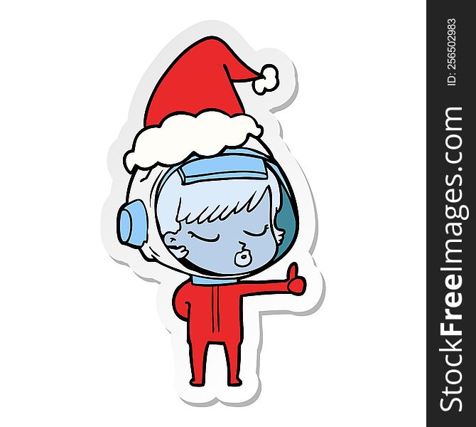 Sticker Cartoon Of A Pretty Astronaut Girl Giving Thumbs Up Wearing Santa Hat