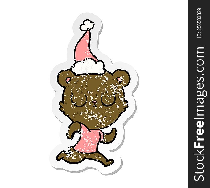 peaceful hand drawn distressed sticker cartoon of a bear running wearing santa hat