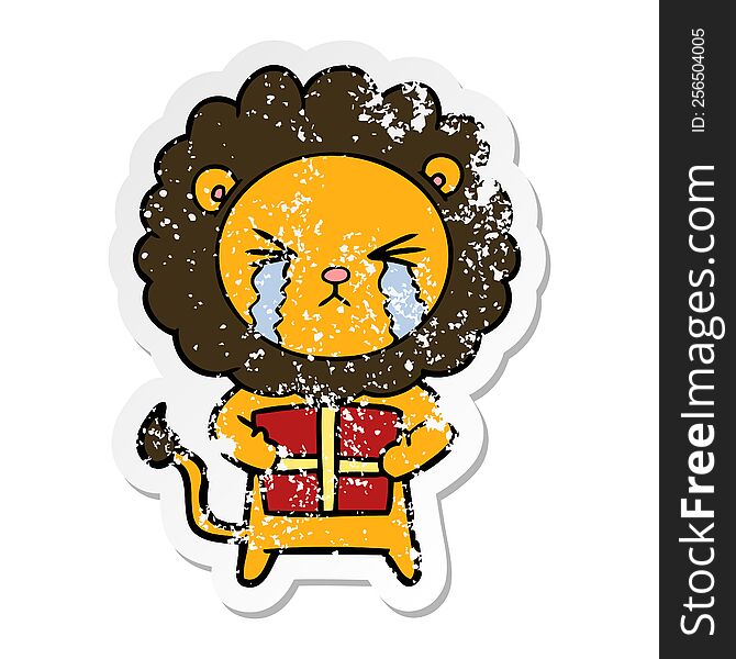 Distressed Sticker Of A Cartoon Crying Lion With Gift
