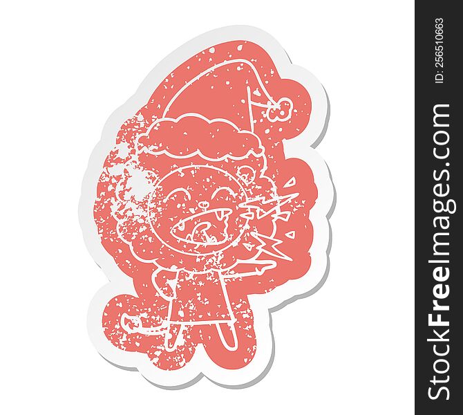 Cartoon Distressed Sticker Of A Roaring Lion Girl Wearing Santa Hat