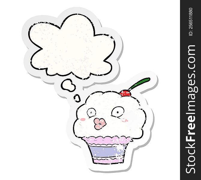 cartoon cupcake and thought bubble as a distressed worn sticker