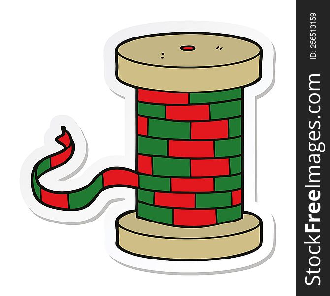 sticker of a cartoon reel of ribbon
