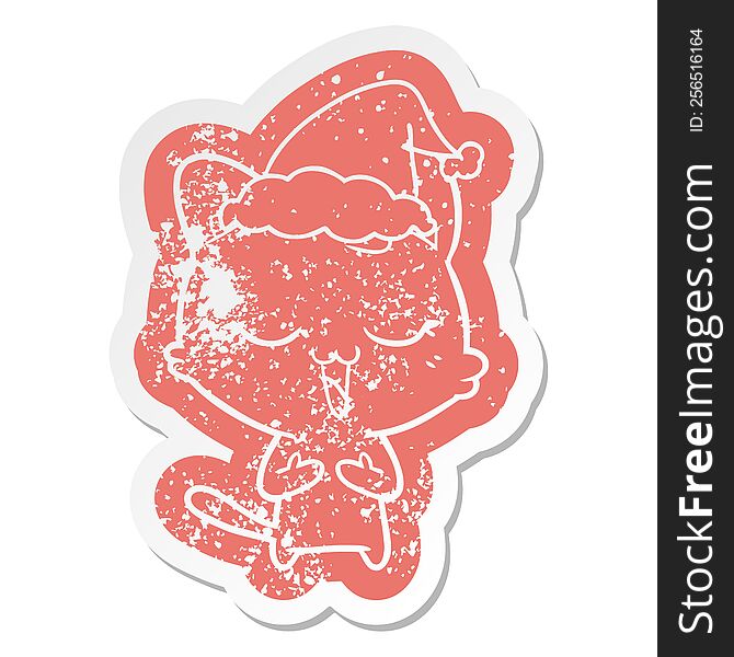 Happy Cartoon Distressed Sticker Of A Cat Wearing Santa Hat