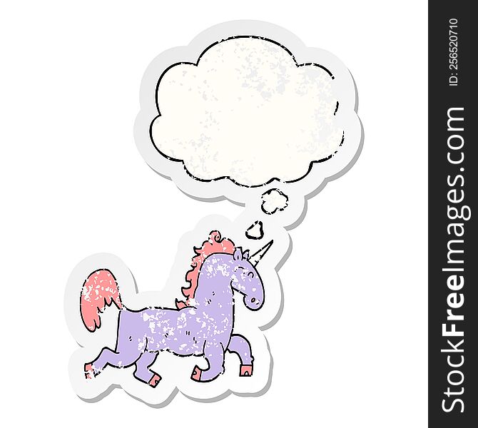 cartoon unicorn with thought bubble as a distressed worn sticker