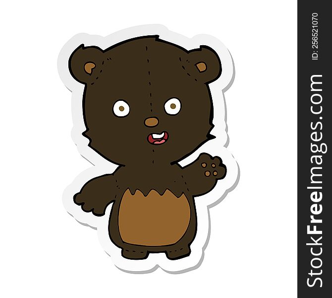 sticker of a cartoon waving black bear cub