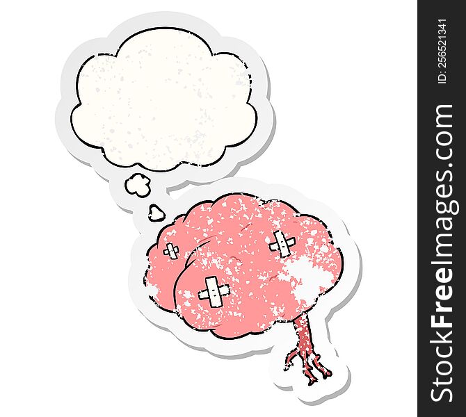 cartoon injured brain with thought bubble as a distressed worn sticker