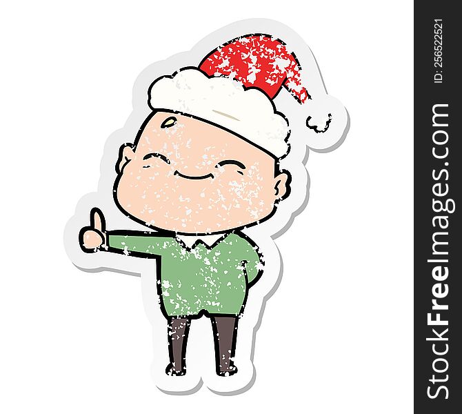 happy hand drawn distressed sticker cartoon of a bald man wearing santa hat