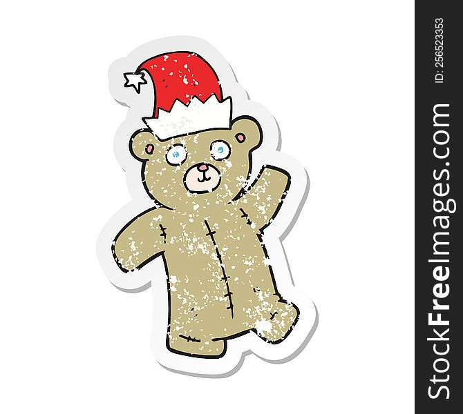 retro distressed sticker of a cartoon teddy bear wearing christmas hat