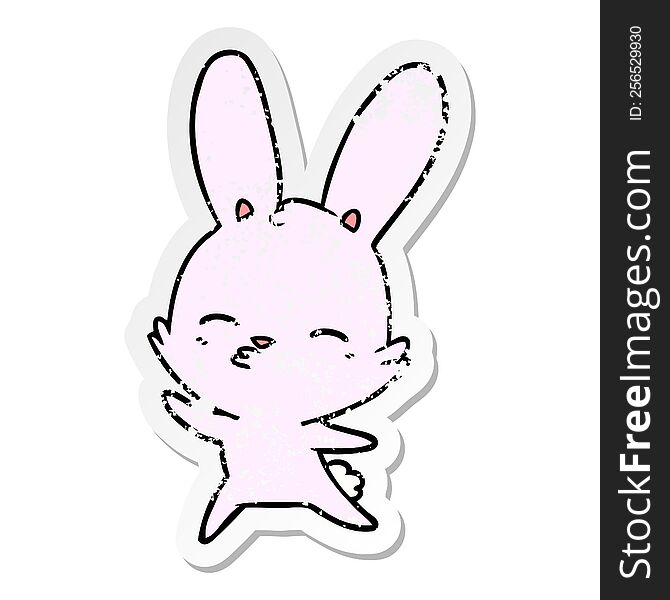 distressed sticker of a curious waving bunny cartoon