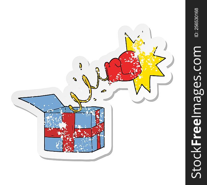 distressed sticker of a trick present with boxing glove