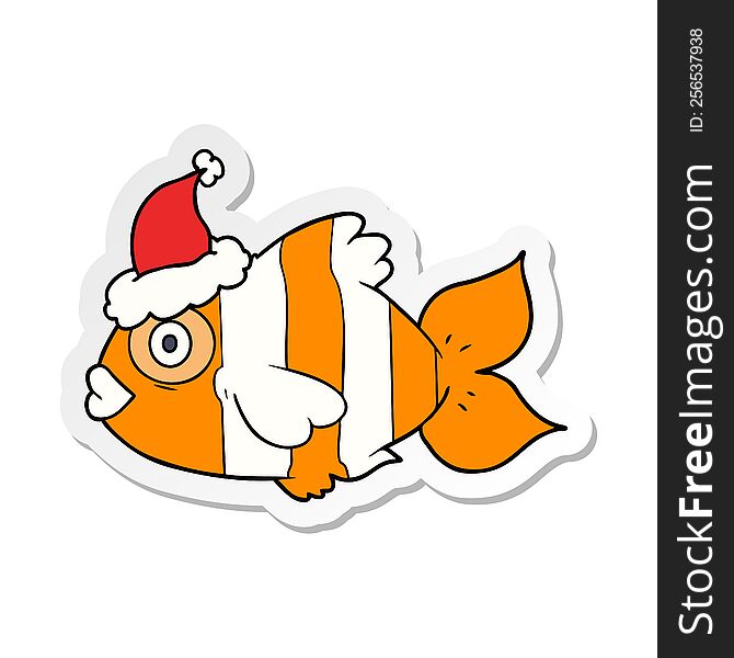 hand drawn sticker cartoon of a exotic fish wearing santa hat