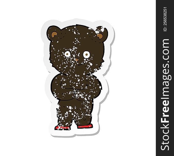 retro distressed sticker of a cartoon teddy black bear cub