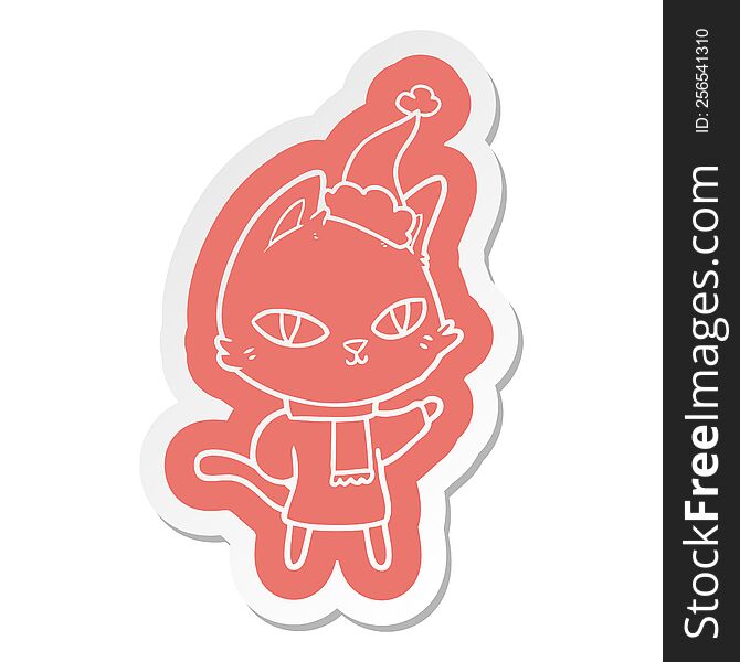 quirky cartoon  sticker of a cat staring wearing santa hat