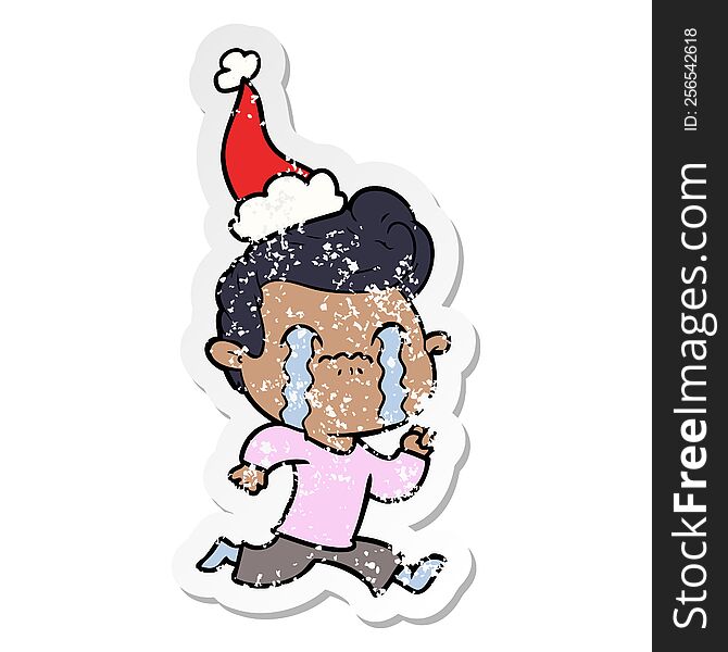 Distressed Sticker Cartoon Of A Man Crying Wearing Santa Hat
