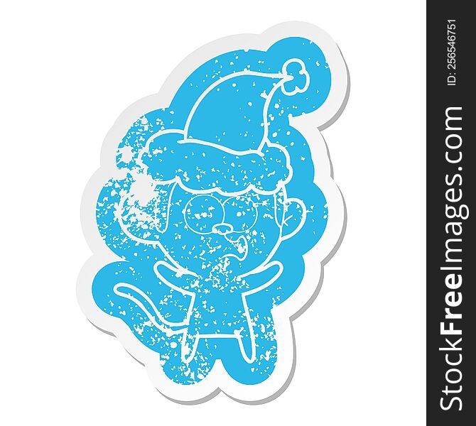 cartoon distressed sticker of a surprised monkey wearing santa hat