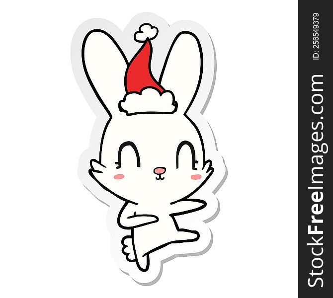 cute hand drawn sticker cartoon of a rabbit dancing wearing santa hat. cute hand drawn sticker cartoon of a rabbit dancing wearing santa hat