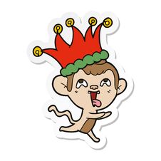 Sticker Of A Crazy Cartoon Monkey Wearing Jester Hat Stock Photo
