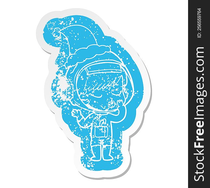 quirky cartoon distressed sticker of a pretty astronaut girl wearing santa hat