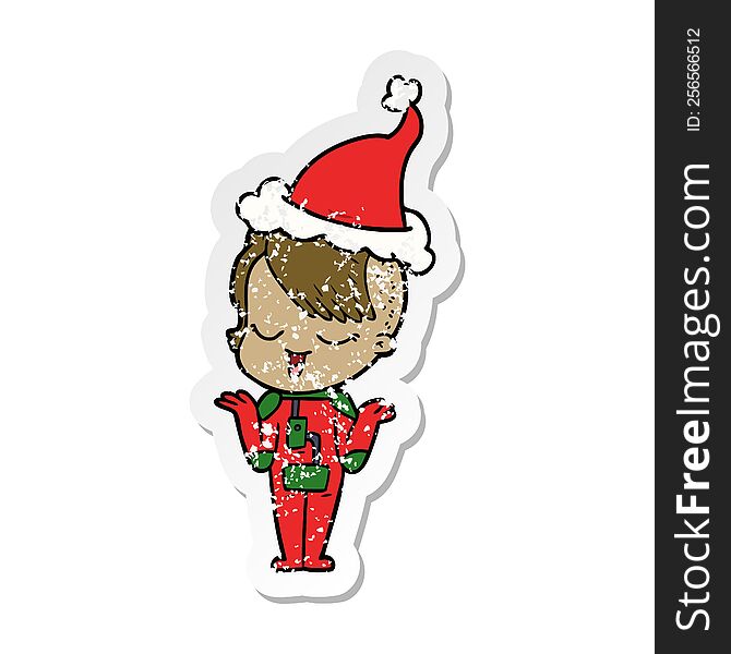 happy hand drawn distressed sticker cartoon of a girl in space suit wearing santa hat