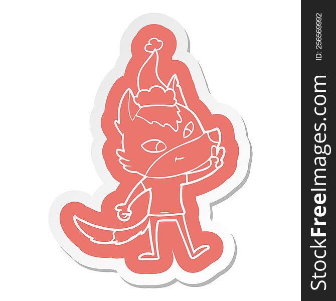 Friendly Cartoon  Sticker Of A Wolf Giving Peace Sign Wearing Santa Hat