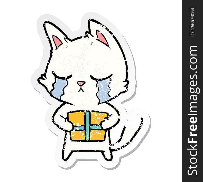 distressed sticker of a crying cartoon cat holding christmas present