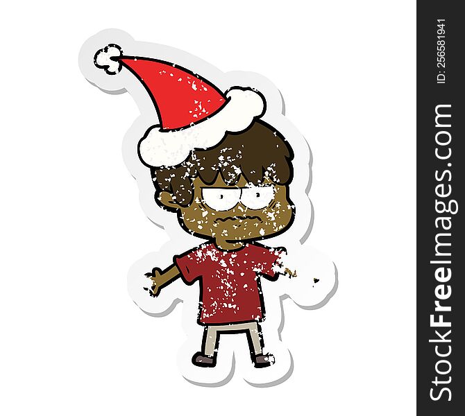 Annoyed Distressed Sticker Cartoon Of A Boy Wearing Santa Hat