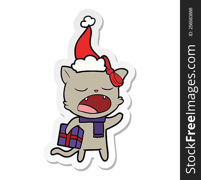 hand drawn sticker cartoon of a cat with christmas present wearing santa hat
